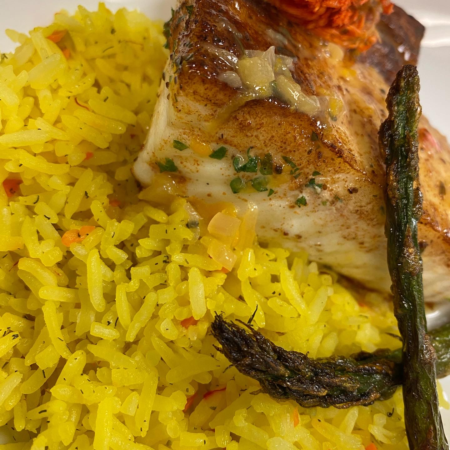 Pan-seared halibut with saffron rice pilaf and roasted asparagus